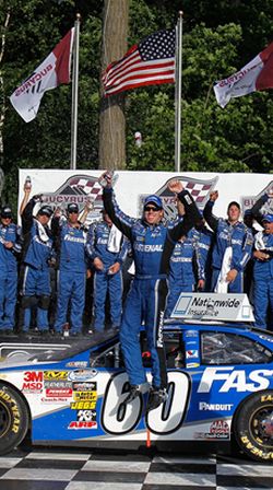 Carl Edwards gets Ford into Victory Lane for the first time in the 2010 season with a win at Road America. Credit: Jonathan Daniel/Getty Images